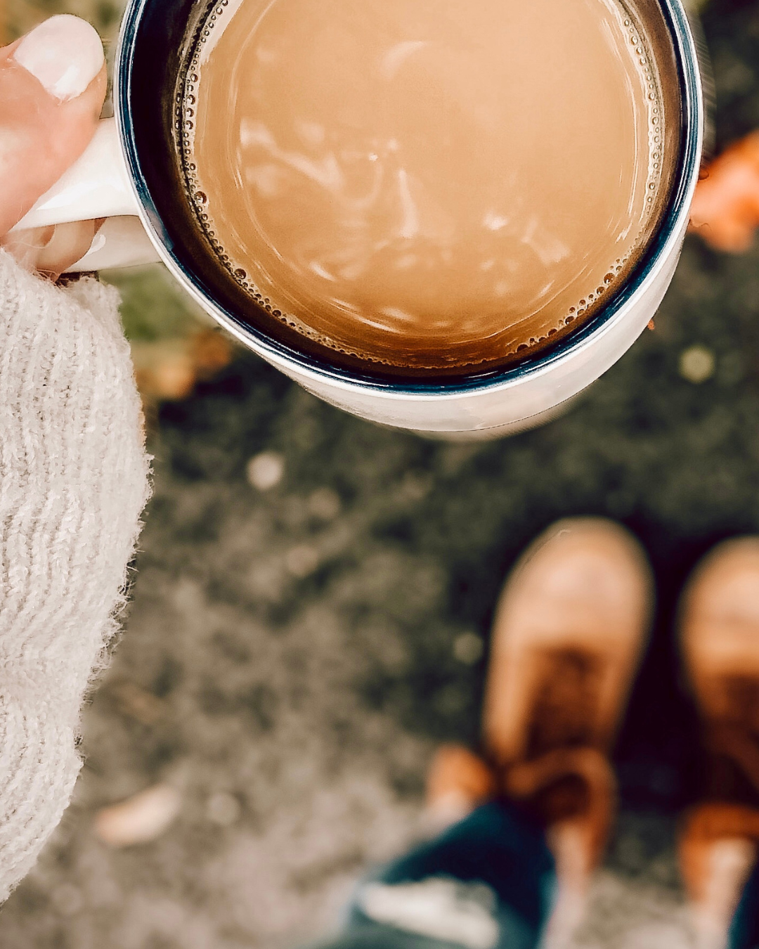 Woman holding a cup of coffee in a peaceful setting
